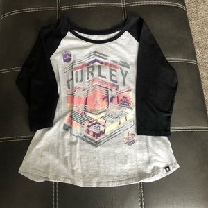 Women’s black and gray Hurley shirt.